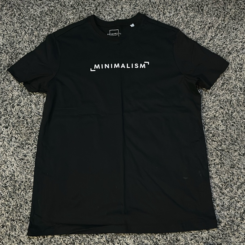 NWOT. Woman’s “minimalism” SonnyBono black T-shirt. Size S.